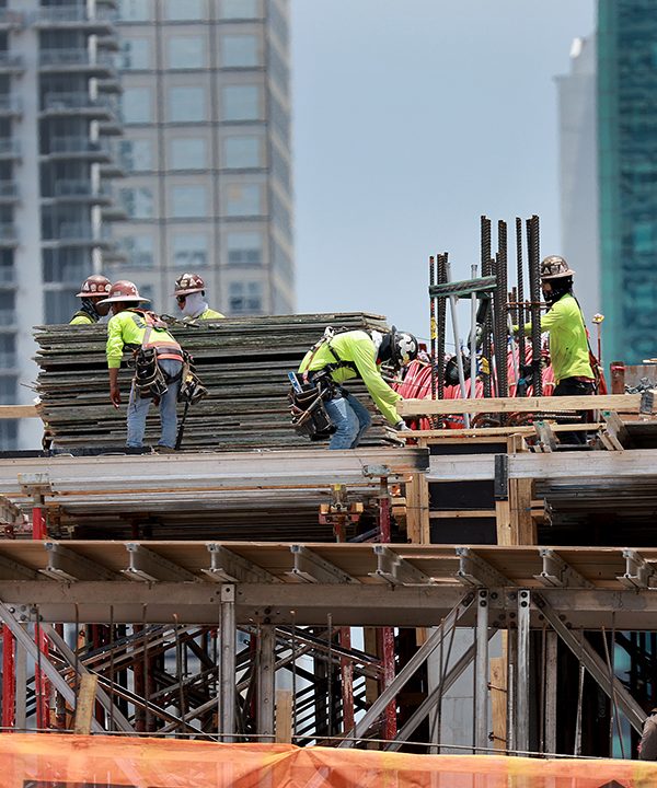 MIAMI, FLORIDA - MAY 05: Construction workers on a job site on May 05, 2023 in Miami, Florida. A report by the Bureau of Labor Statistics showed the US economy added 253,000 jobs in April.  (Photo by Joe Raedle/Getty Images)